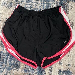 Black and pink women’s Nike athletic shorts